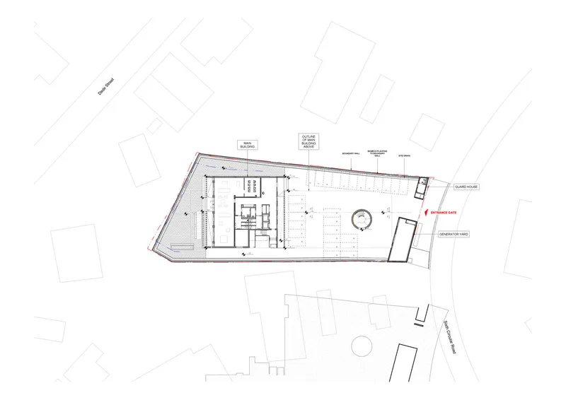 Ground floor plan drawing showing workspace areas and a circular feature within an angled site