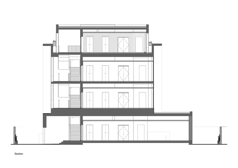 Section drawing illustrating four levels with central staircases and repetitive window openings along the facade