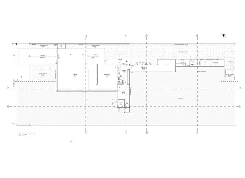 Floor plan drawing showing elongated volumes with a central circulation spine and service core
