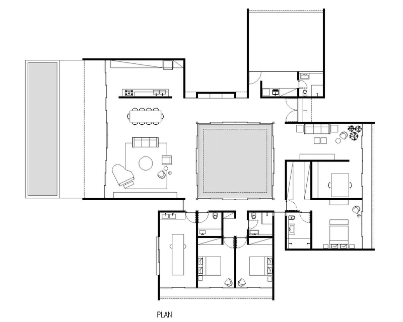 Floor plan drawing showing living spaces wrapping around a central courtyard pool with bedrooms clustered at one end