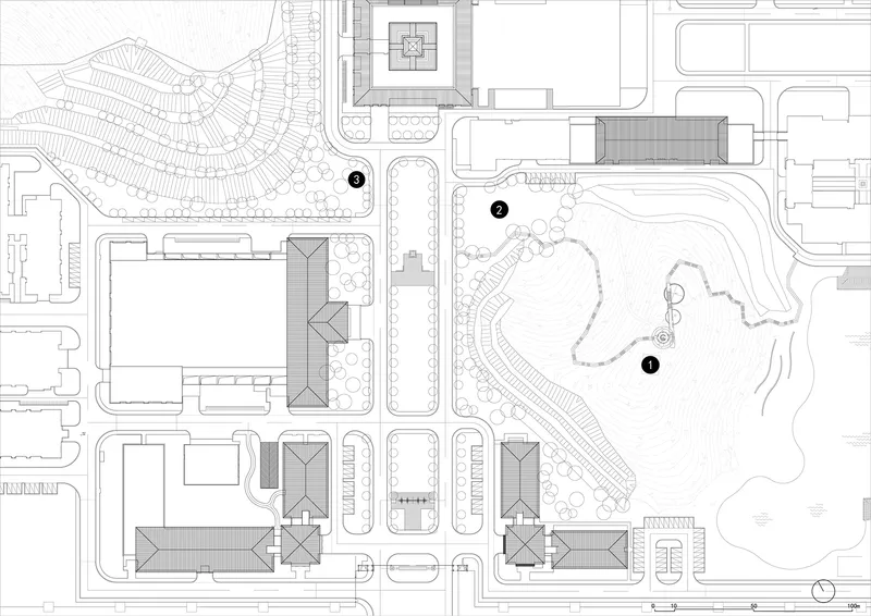 Site plan drawing showing campus buildings, pathways, and a landscaped park with circulation routes