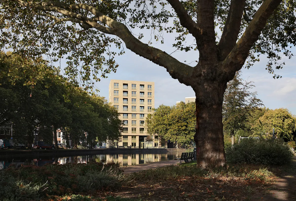 Van Bergen Kolpa Architects Stack 36 Social Homes into a Sculpted Brick Landmark on Rotterdam's River Rotte