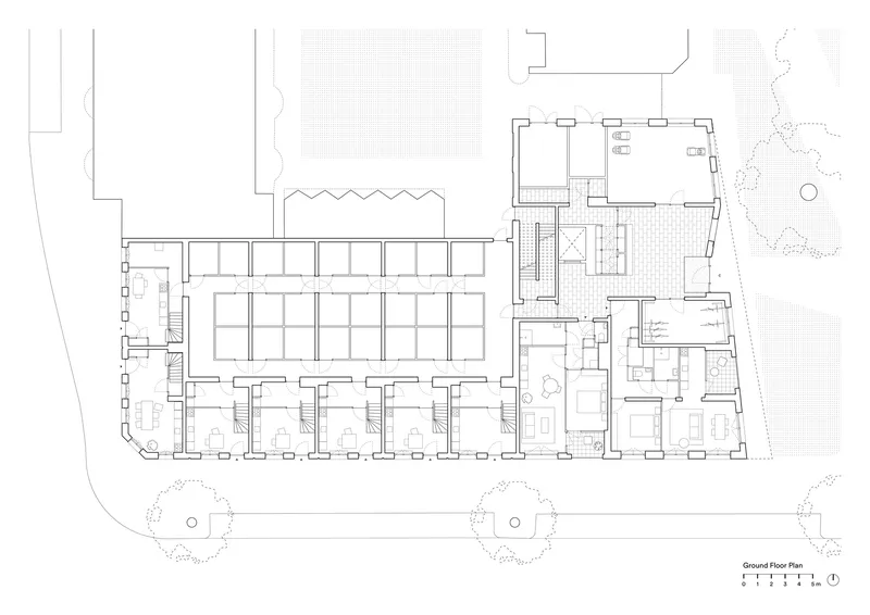 Ground floor plan drawing displaying a row of townhouse units with individual entries and street trees