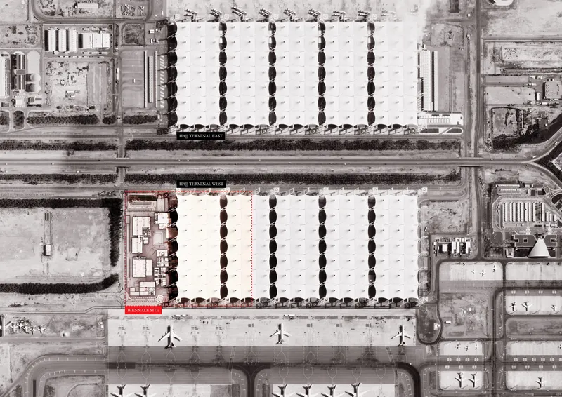 Aerial view showing two parallel courtyard buildings separated by a roadway and pedestrian plaza