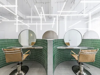 Inrestudio Folds a Single Sculptural Wall Through a Ho Chi Minh City Hair Salon