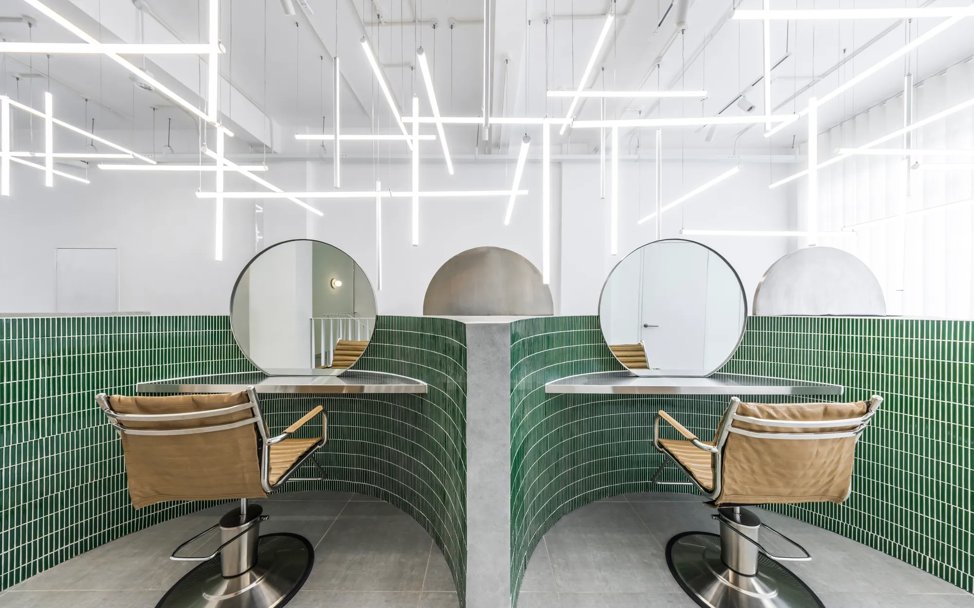 Inrestudio Folds a Single Sculptural Wall Through a Ho Chi Minh City Hair Salon