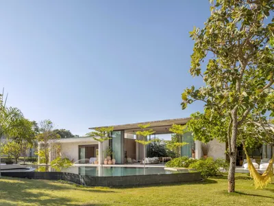 Studio Gontijo Splits a Brasília House into Two Wings Joined by a Glass Pavilion