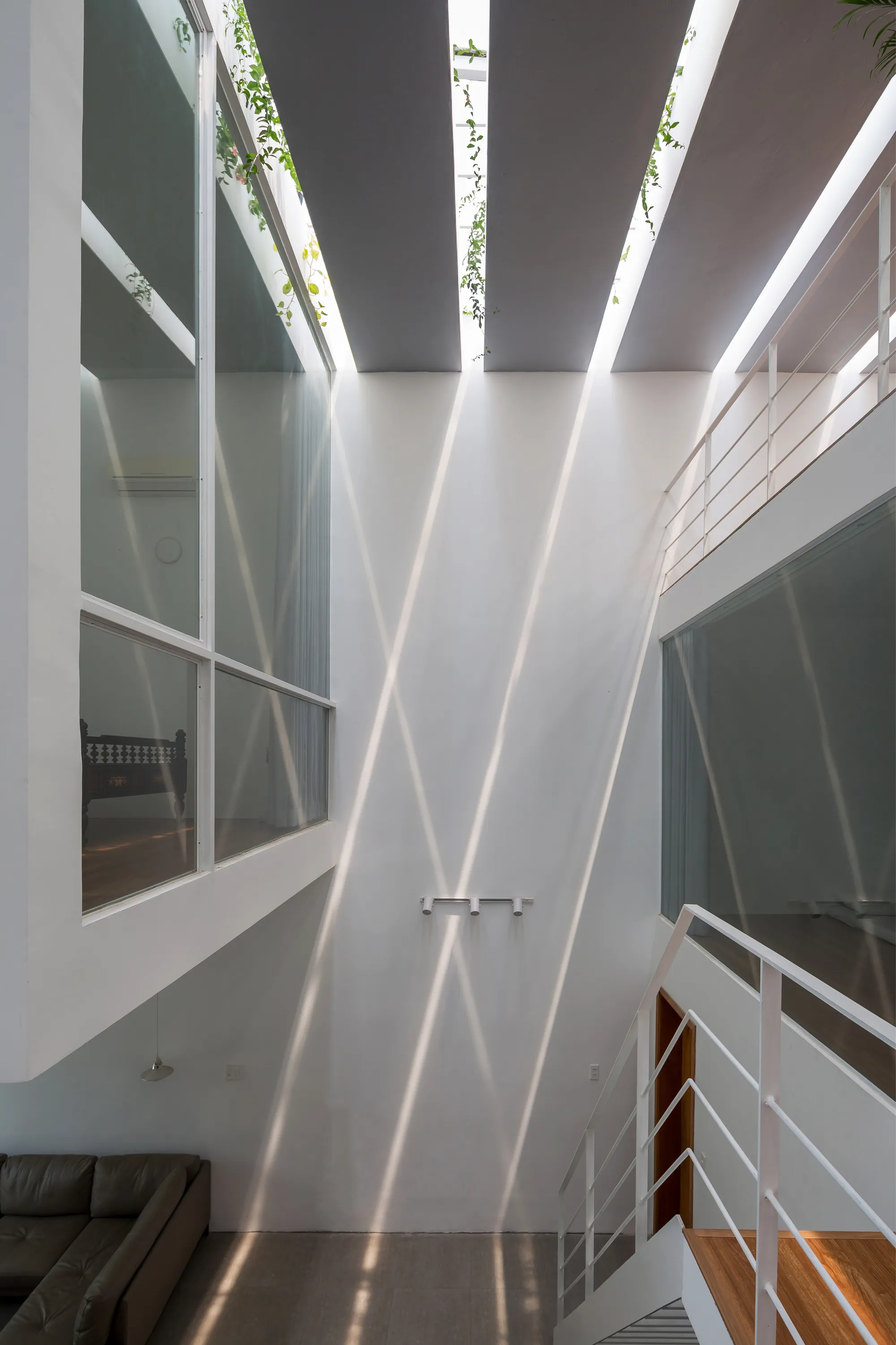 BHA Studio Sculpts Light and Air into a Single-Shell Concrete House in Central Vietnam