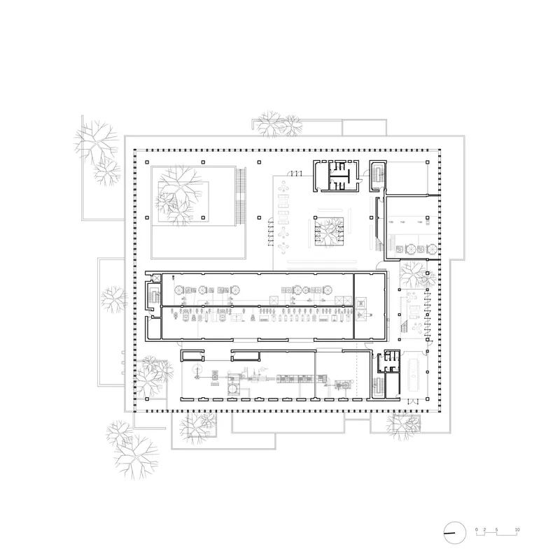 Floor plan drawing showing a rectangular perimeter colonnade enclosing courtyards and a central dining hall with furniture