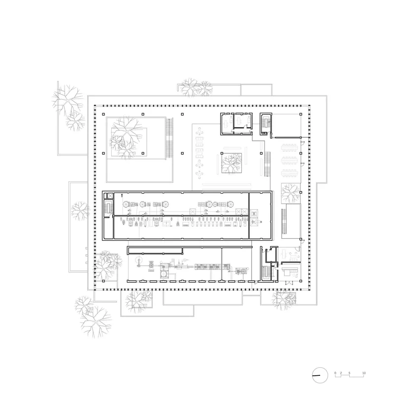 Floor plan drawing showing the same layout with columns and service rooms arranged around internal courtyards