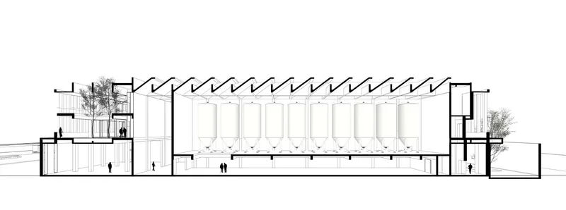 Section drawing showing the exposed timber roof truss system over a tall interior hall with figures below