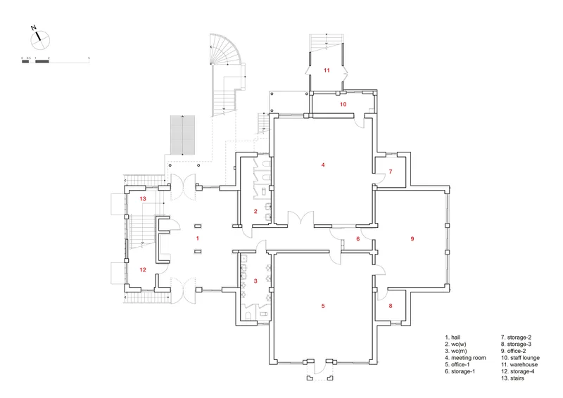 Floor plan drawing showing rooms arranged around a central hall with curved stair and labeled storage areas