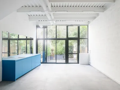 miogui Converts a Montreuil Commercial Unit into a Layered Glass-and-Steel Loft