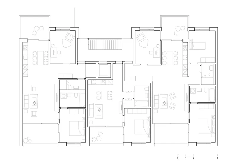 Floor plan drawing depicting dwelling units with open-plan living areas and private balconies