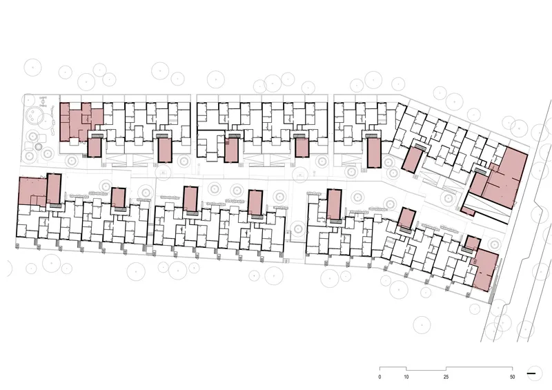 Site plan drawing showing two parallel residential bars with pink-toned communal cores and surrounding trees