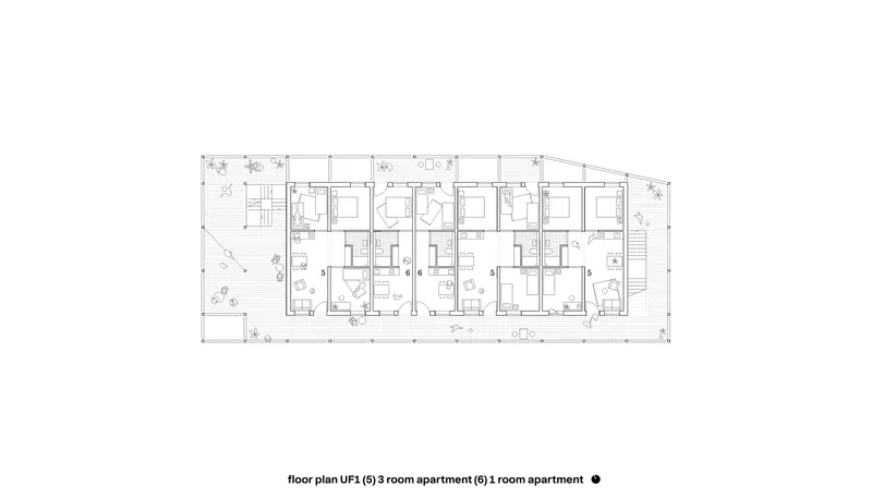 Floor plan drawing showing multiple residential units arranged in a linear configuration