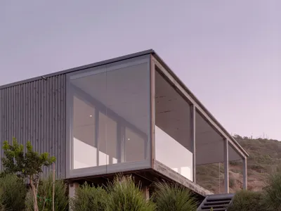Stanaćev Granados Perches a Timber and Glass House on a Chilean Coastal Hillside for Visiting Grandparents