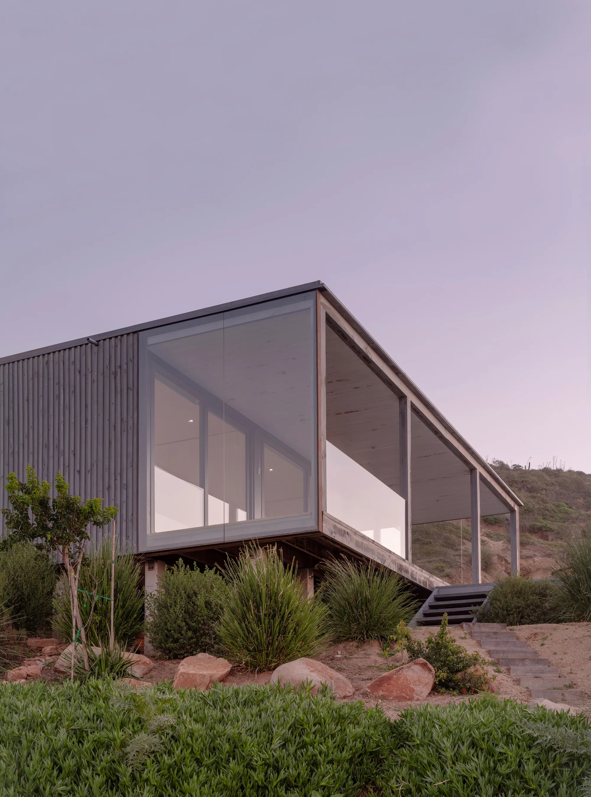 Stanaćev Granados Perches a Timber and Glass House on a Chilean Coastal Hillside for Visiting Grandparents