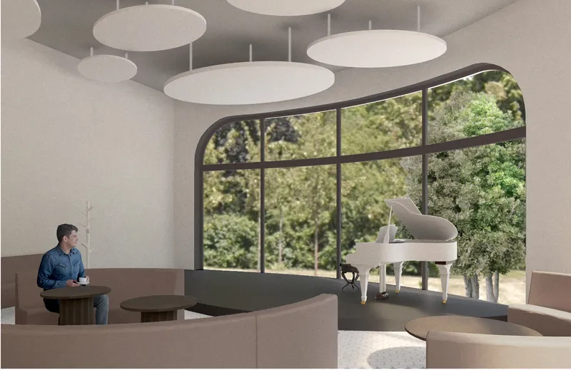 Piano stage zone designed for music evenings, poetry events, and intimate cultural gatherings.