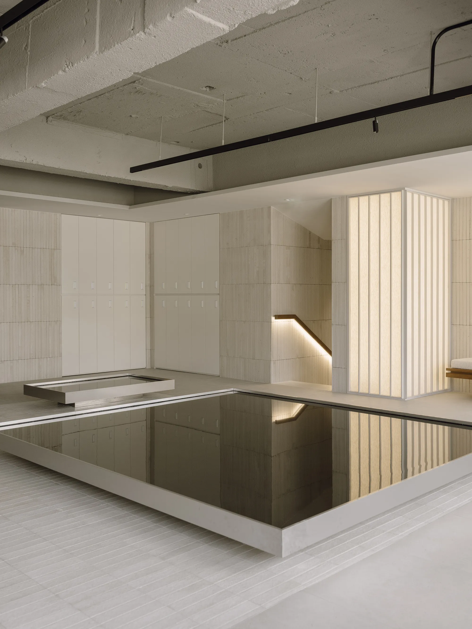 TYPE S Floods a Seoul Hair Salon with Reflective Pools and Ribbed Tile Volumes