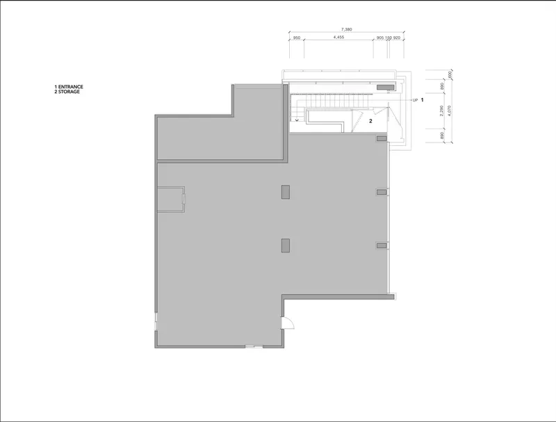 Floor plan drawing showing entrance with storage area and stairwell at upper right corner