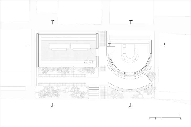 Plan drawing showing rectangular and curved volumes connected by planted courtyards and stepped entry