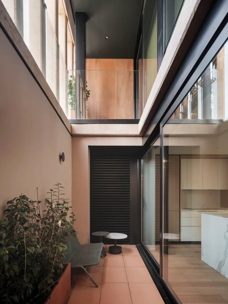 Private terrace with skylight above and glazed sliding door opening to the kitchen