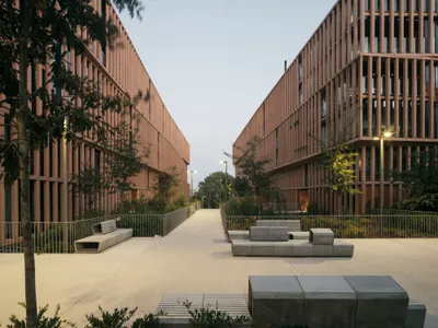 Carbajo Barrios Arquitectos Wraps 125 Apartments in a Ferruginous Lattice on a Former Railway Site