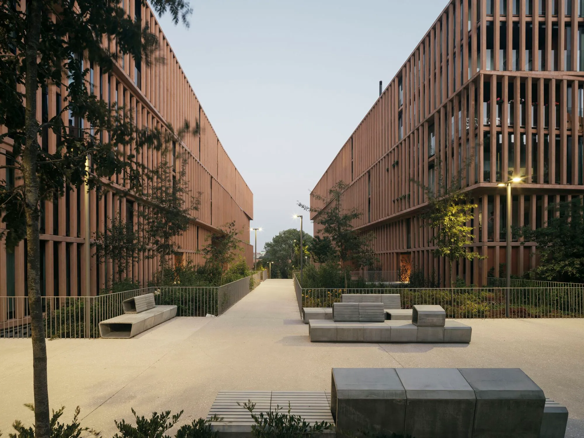 Carbajo Barrios Arquitectos Wraps 125 Apartments in a Ferruginous Lattice on a Former Railway Site
