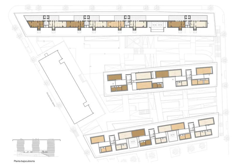 Ground and lower level floor plan drawing showing the angled building footprints on sloped terrain