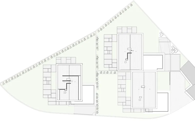 Floor plan drawing showing upper level layouts with bedrooms and staircases in two buildings