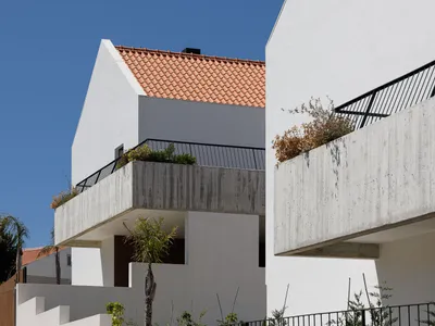 Esquissos Splits a Sintra Hillside into Three Houses That Disappear into Their Landscape