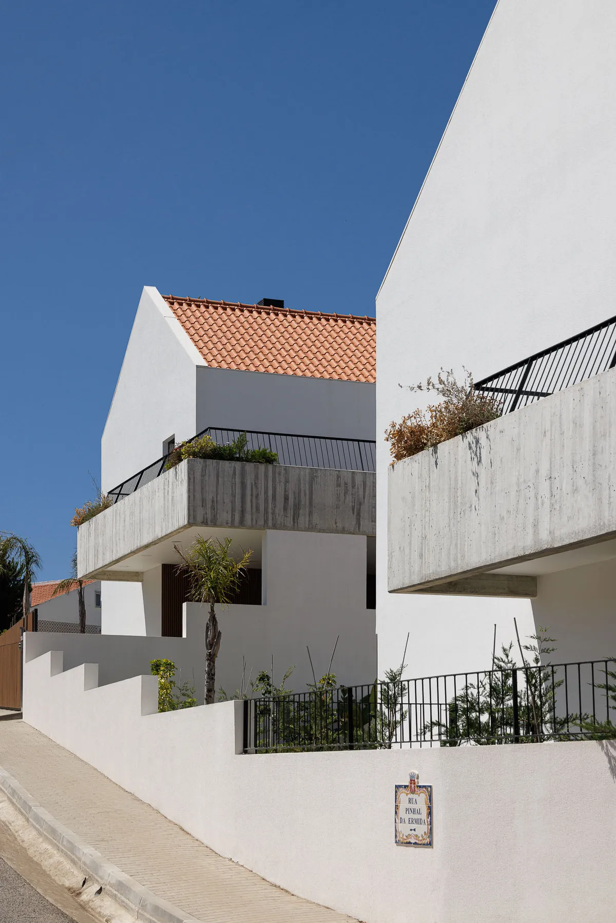 Esquissos Splits a Sintra Hillside into Three Houses That Disappear into Their Landscape