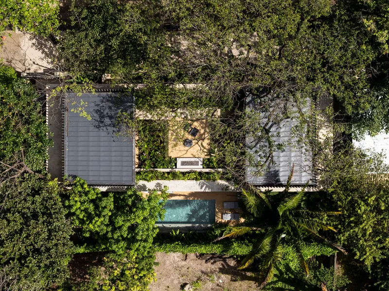 Aerial view of the concrete roof slab nestled among dense tree canopy