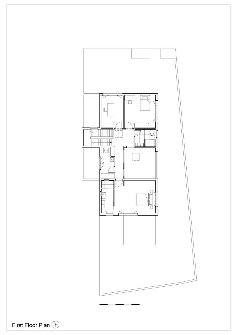 First floor plan drawing showing a residence with bedrooms, staircase and terrace on an angled lot