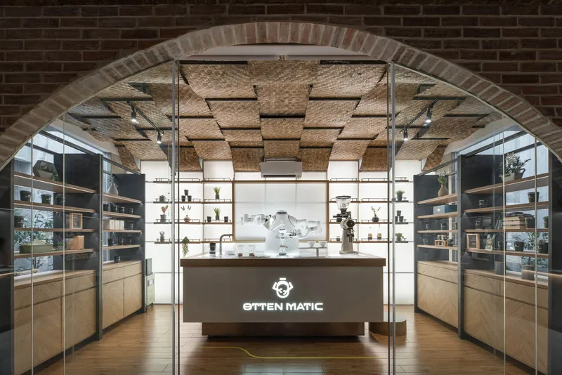 Coffee bar framed by brick arch with espresso machine centered beneath the woven ceiling treatment