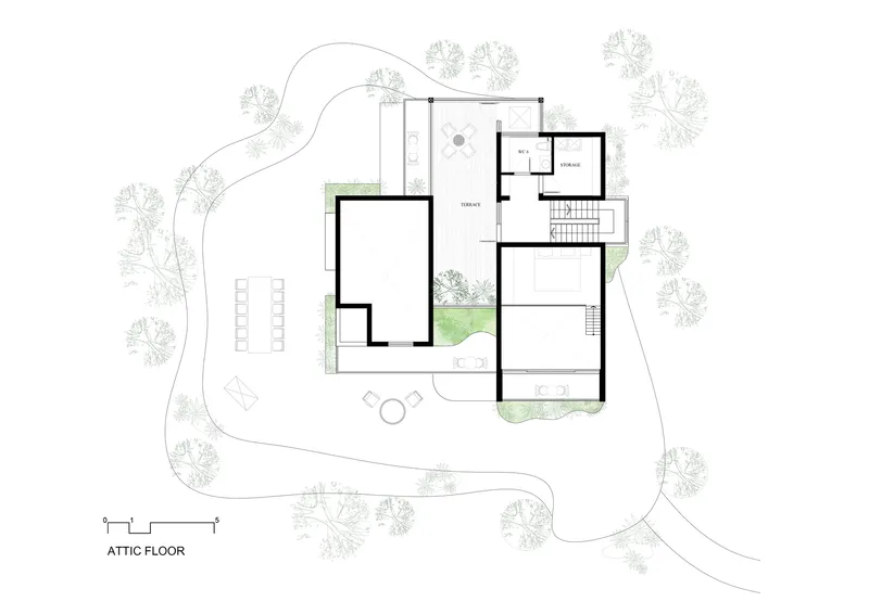 Attic floor plan drawing showing bedroom suite and storage zones with surrounding tree canopy illustrated
