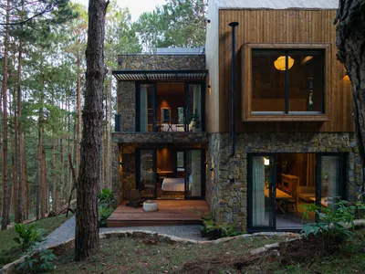 APS Concept Wraps a Dalat Forest Villa in Pine Wood and Stone to Blur the Line Between Shelter and Canopy
