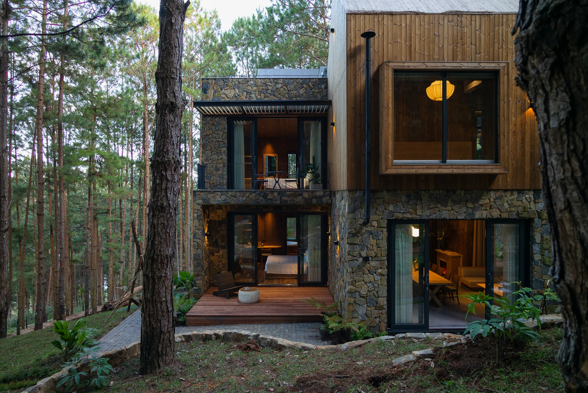 APS Concept Wraps a Dalat Forest Villa in Pine Wood and Stone to Blur the Line Between Shelter and Canopy