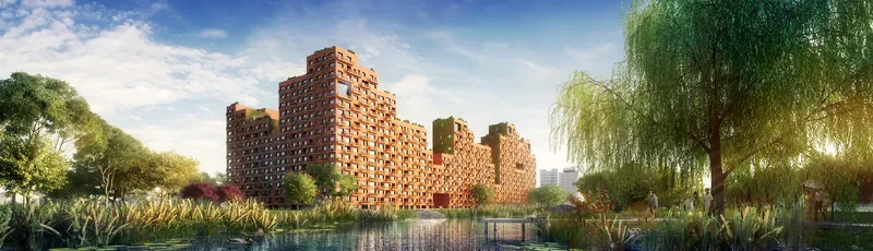 Perforated brick tower complex viewed across a reflecting pond with willow trees and planted beds