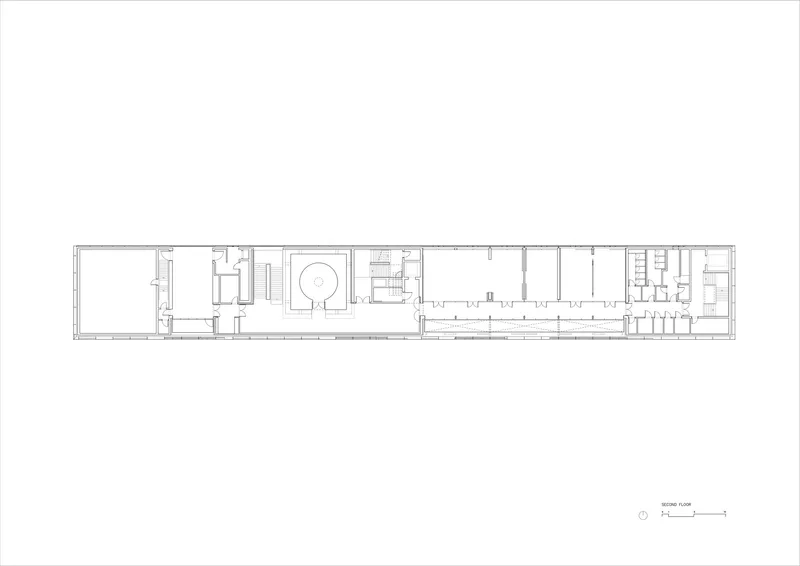 Second floor plan drawing showing narrow linear organization with central circulation spine