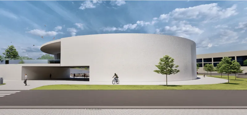 Minimal white exterior shaped by curved geometry and soft landscape integration.