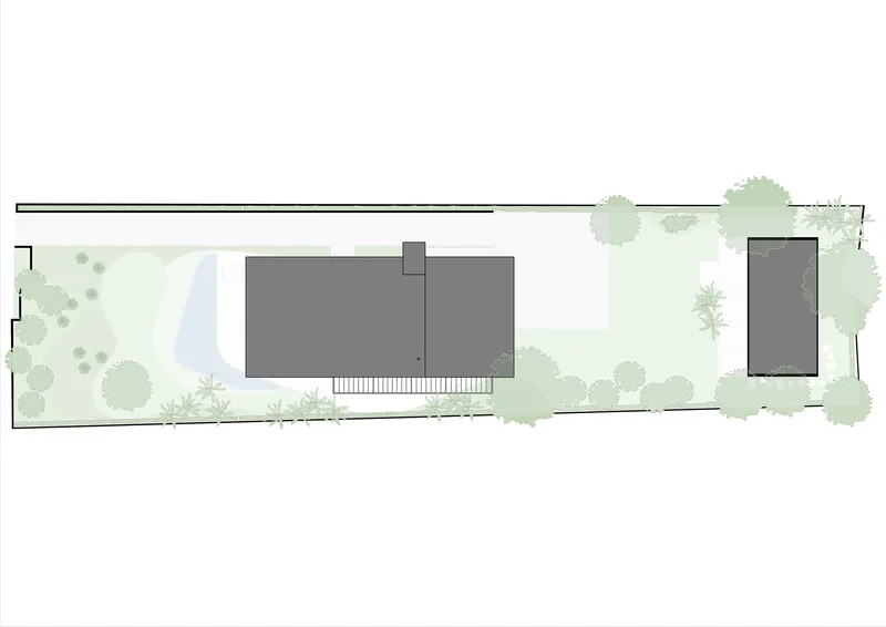Site plan illustrating building footprint in dark gray with pool, lawn, and perimeter vegetation