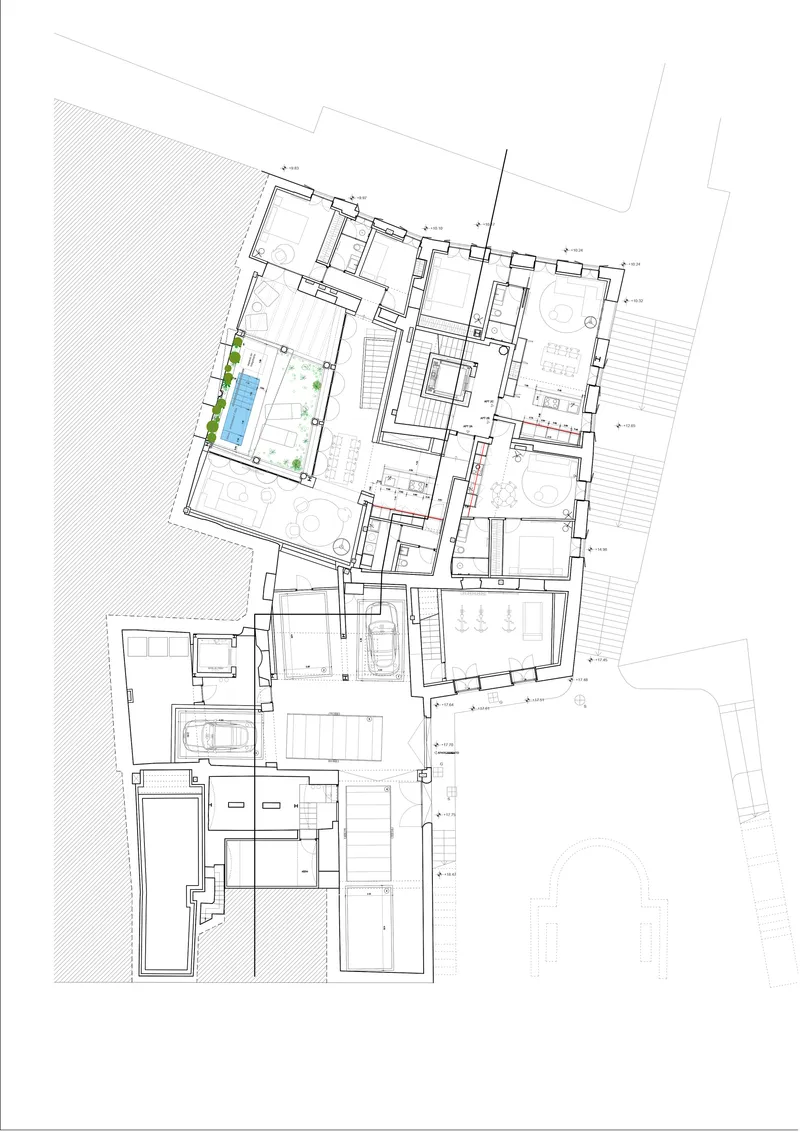 Floor plan drawing showing residential units arranged around courtyards with a pool in the upper corner