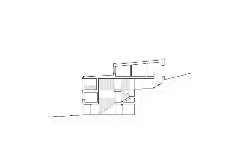 Section drawing showing split-level interior spaces with a central staircase connecting multiple floors