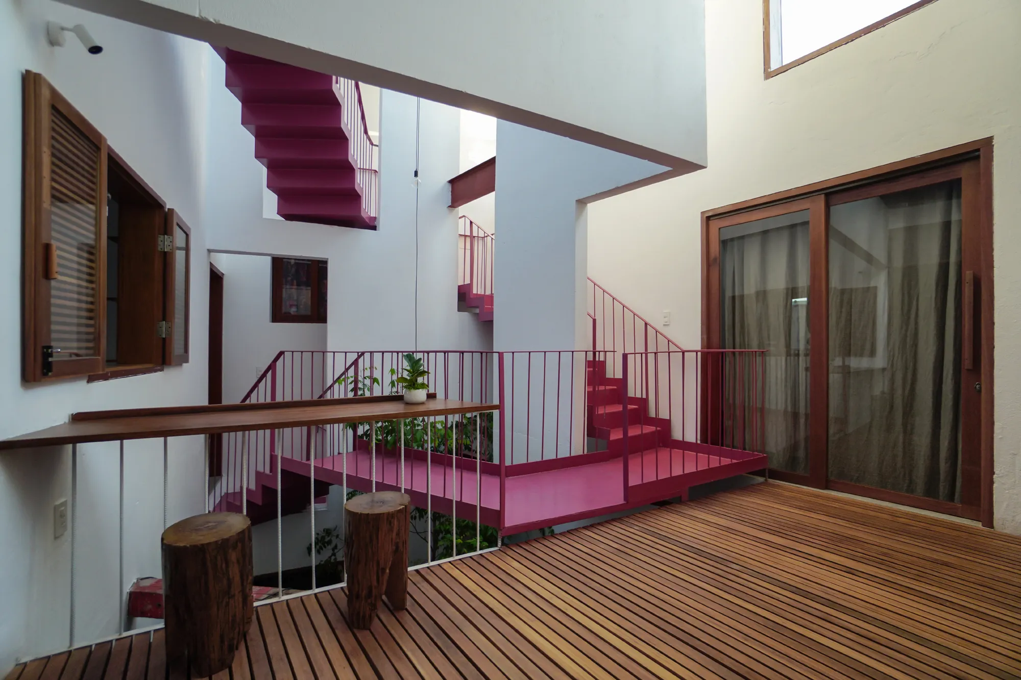 Nghia-Architect Spirals a Da Nang Townhouse Around a Courtyard Core Built from Old Boats