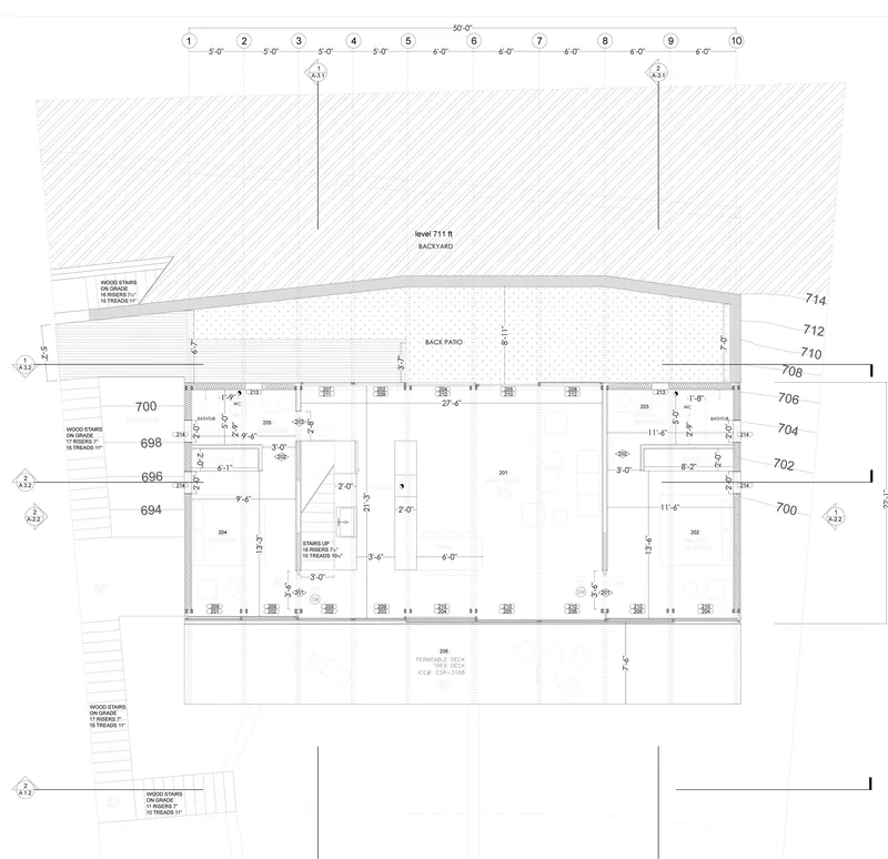 Floor plan drawing showing linear layout with central living space and front and back patios