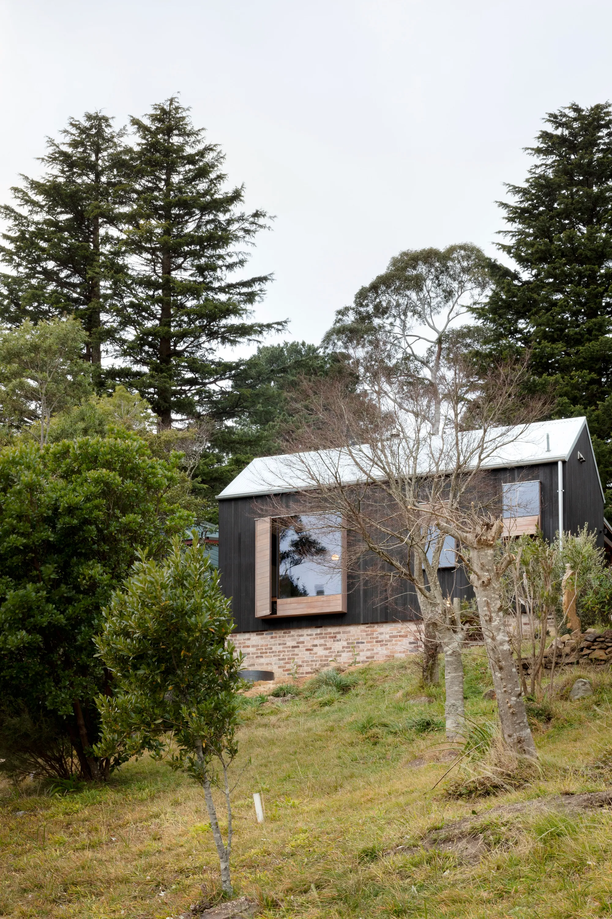 SMITH Architects Wraps a 120-Year-Old Cottage in a Charred Timber Shell to Survive Bushfire