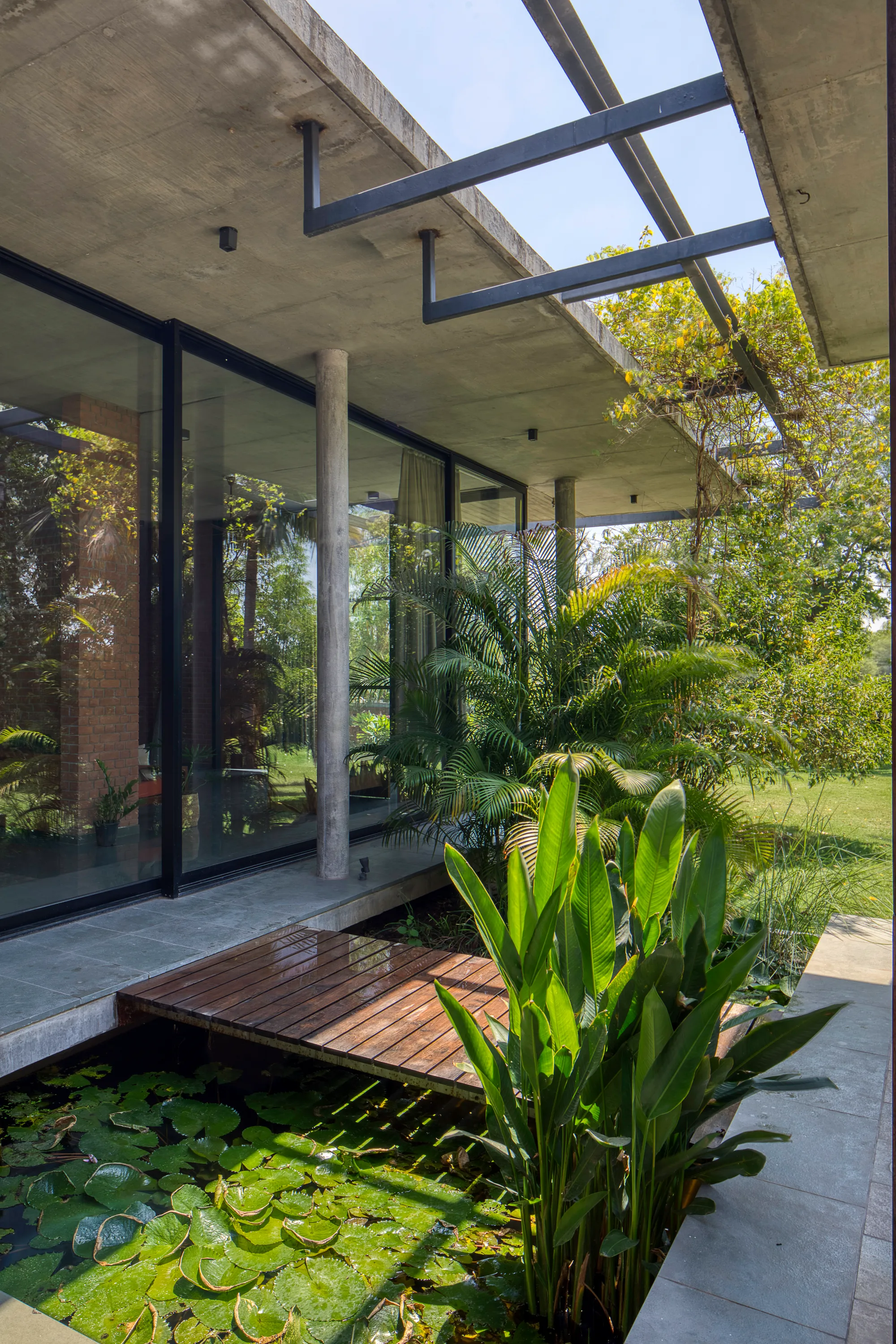 Rushi Shah Architects and Tattva Landscapes Float a Cantilevered Home Over a Lotus Pond in Ahmedabad