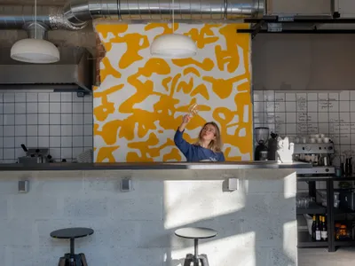FREYA Architects Strips a Belgrade Storefront Back to Raw Concrete for a Youth-Driven Eatery